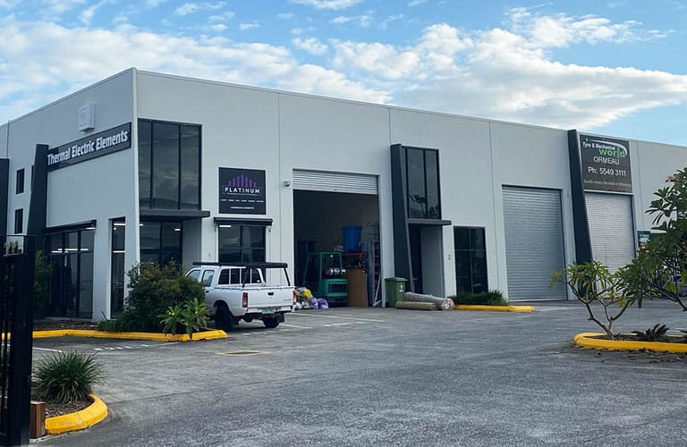 Commercial factory refurbishment completed by Airey Building Group in Ormeau, featuring external building repainting, new security fencing and gate, and professionally completed car park line marking. Commercial refurbishment Ormeau Industrial building refurbishment Factory repainting Gold Coast Commercial painting contractor Car park line marking Security fencing and gates Industrial property maintenance Warehouse refurbishment Commercial building maintenance Commercial builder Ormeau Gold Coast industrial construction Airey Building Group